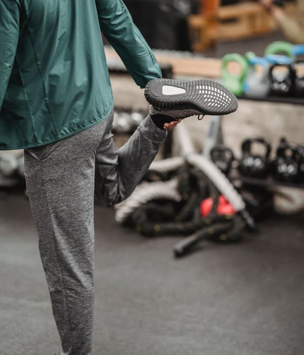 Athlete in a dynamic pose, symbolizing energy and vitality, against a dark background.